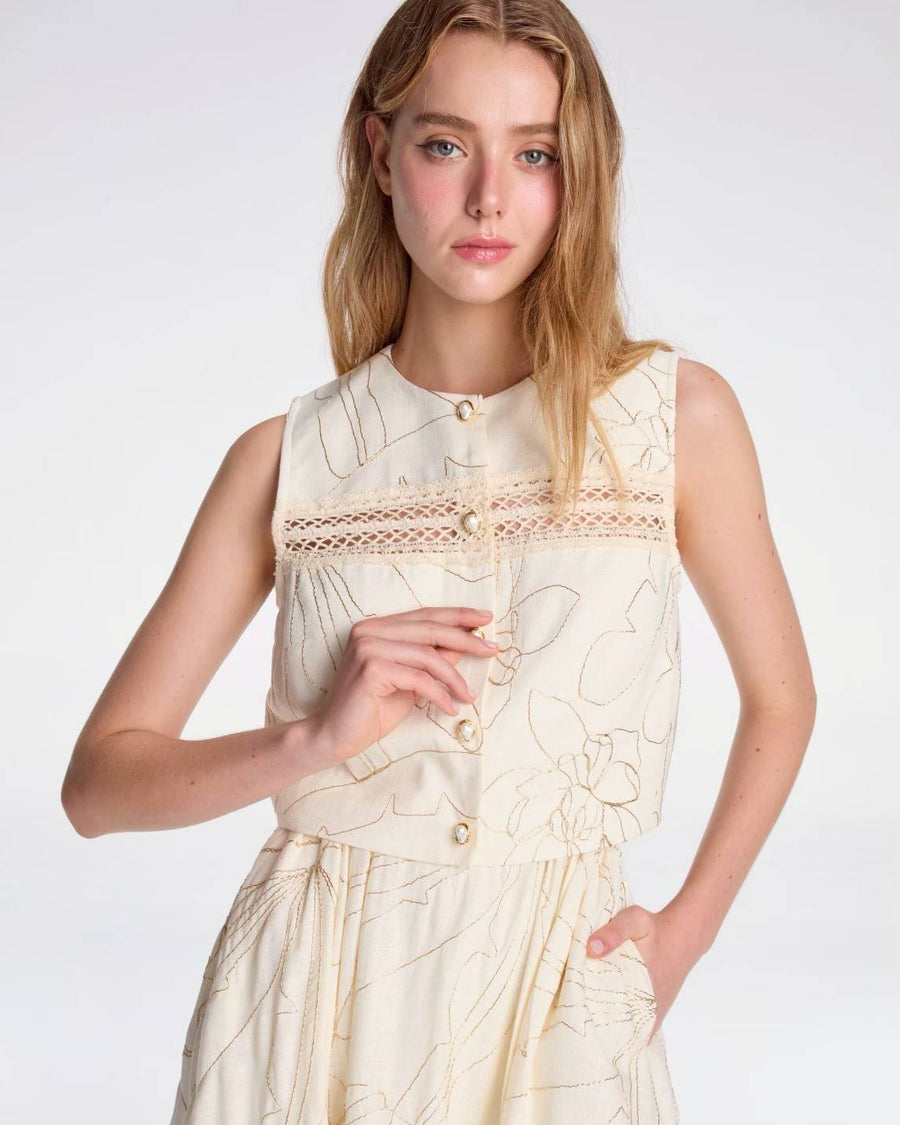 Sleeveless crop top with gold embroidery