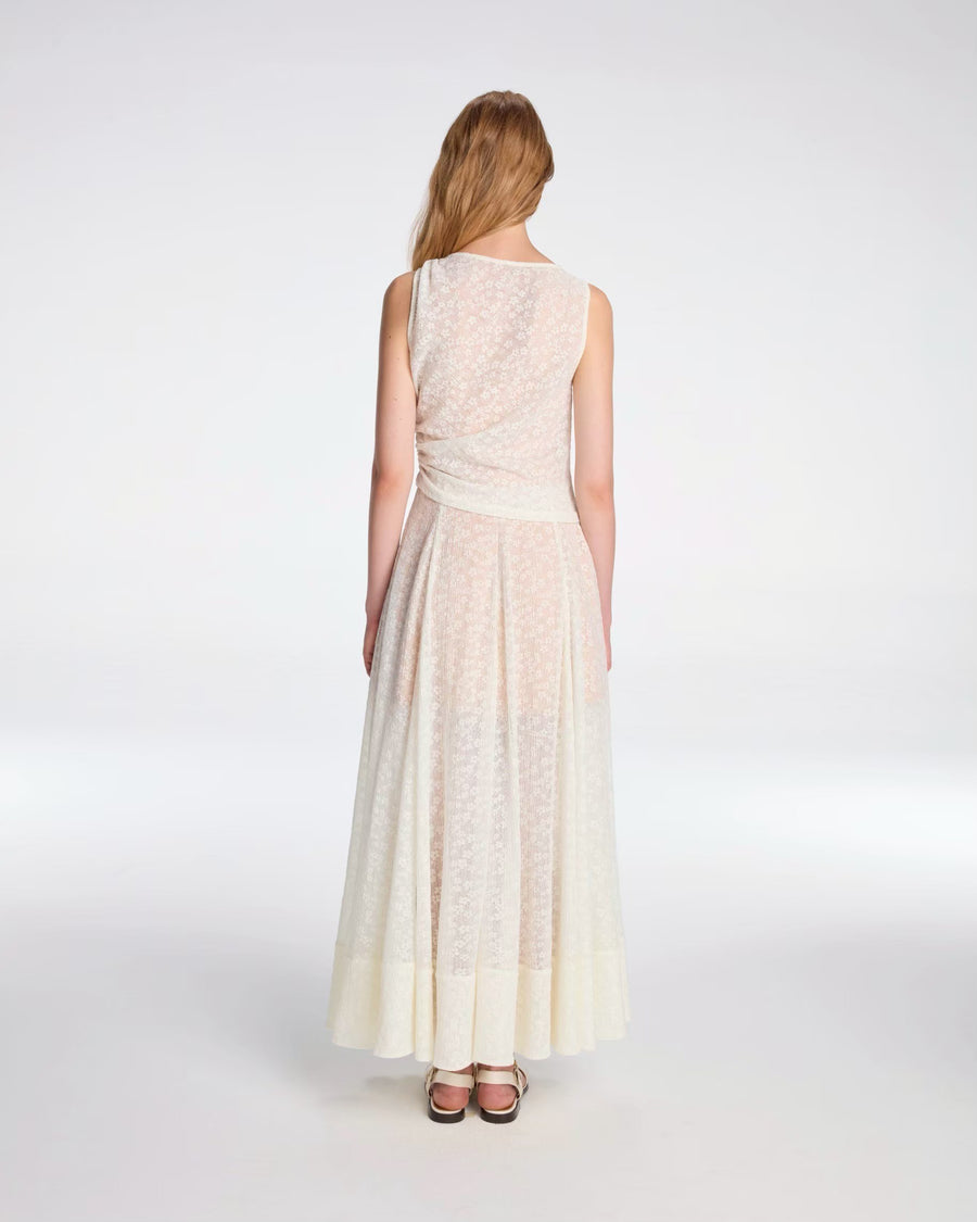 Draped top tied with metallic ornament