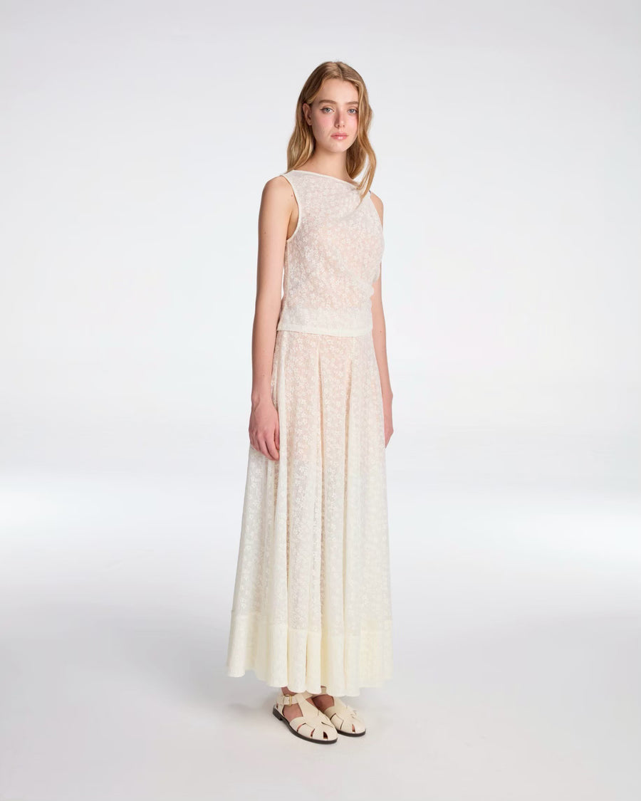 Draped top tied with metallic ornament