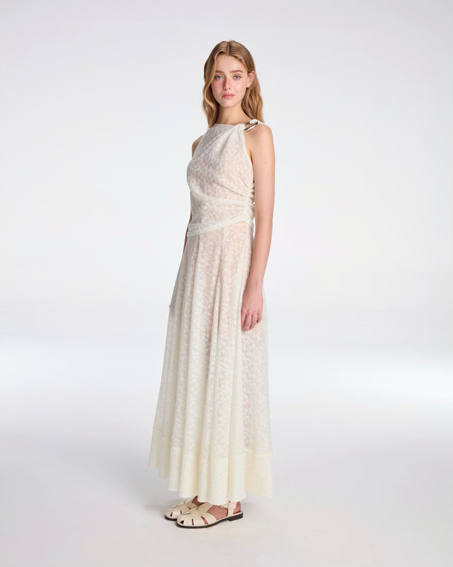 Draped top tied with metallic ornament