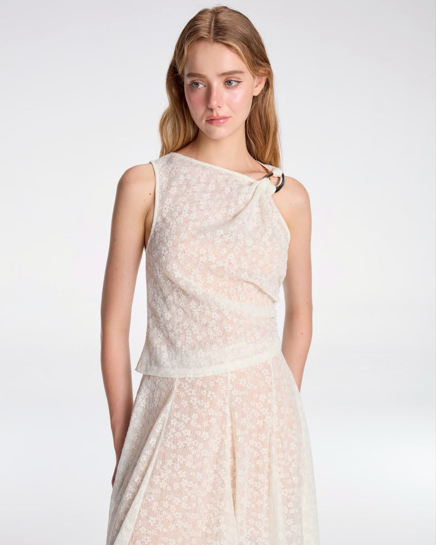 Draped top tied with metallic ornament