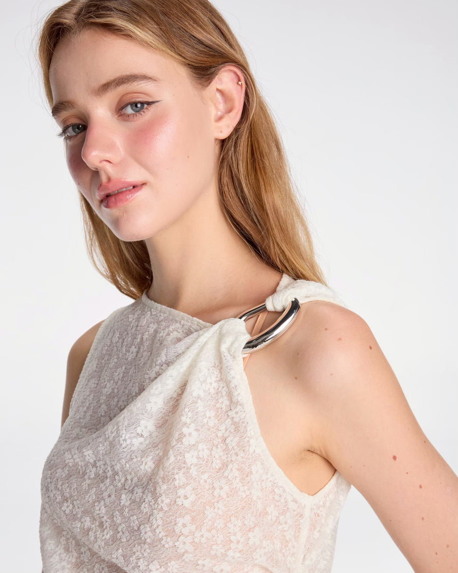 Draped top tied with metallic ornament