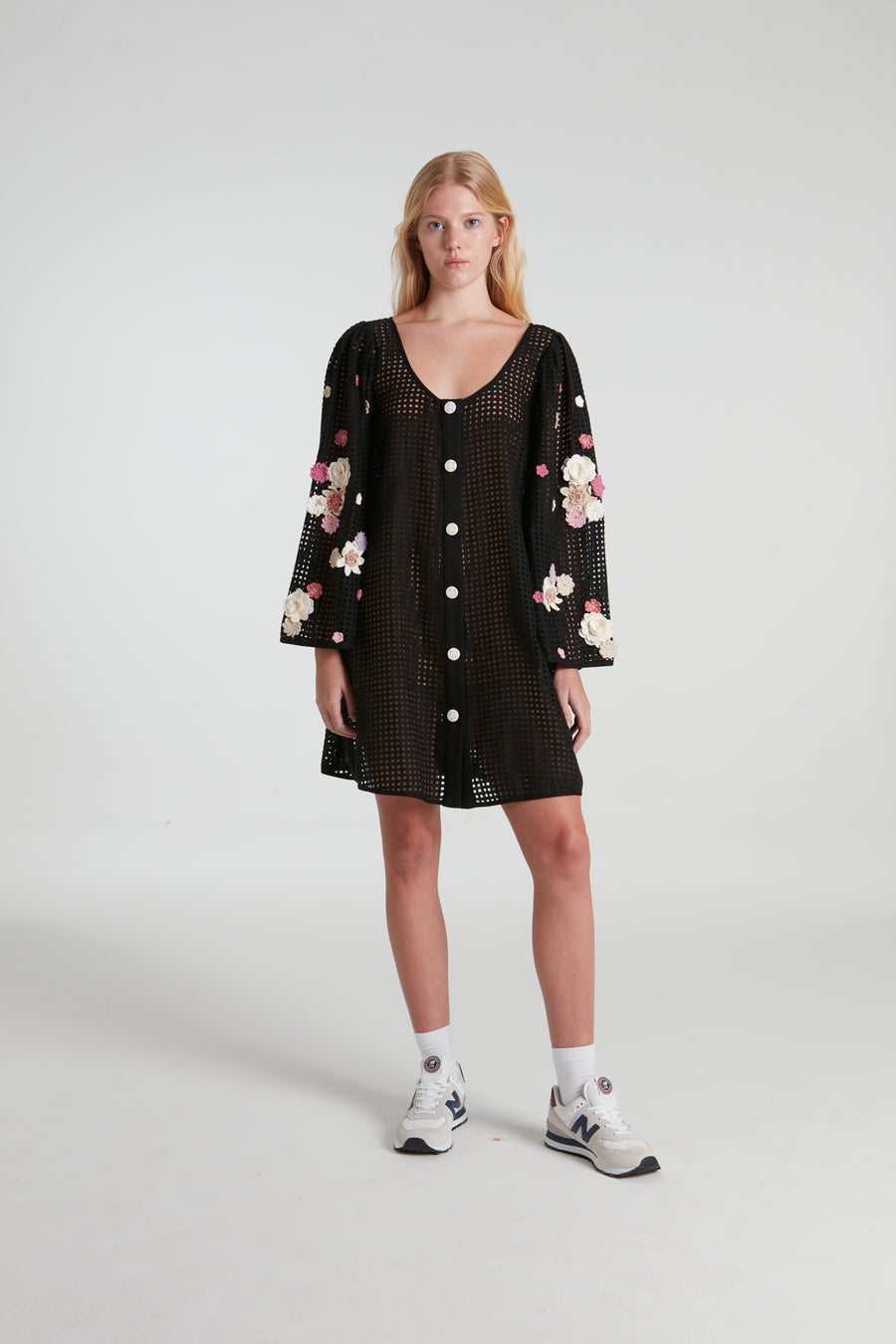 Black stenciled short dress decorated with knitted flowers