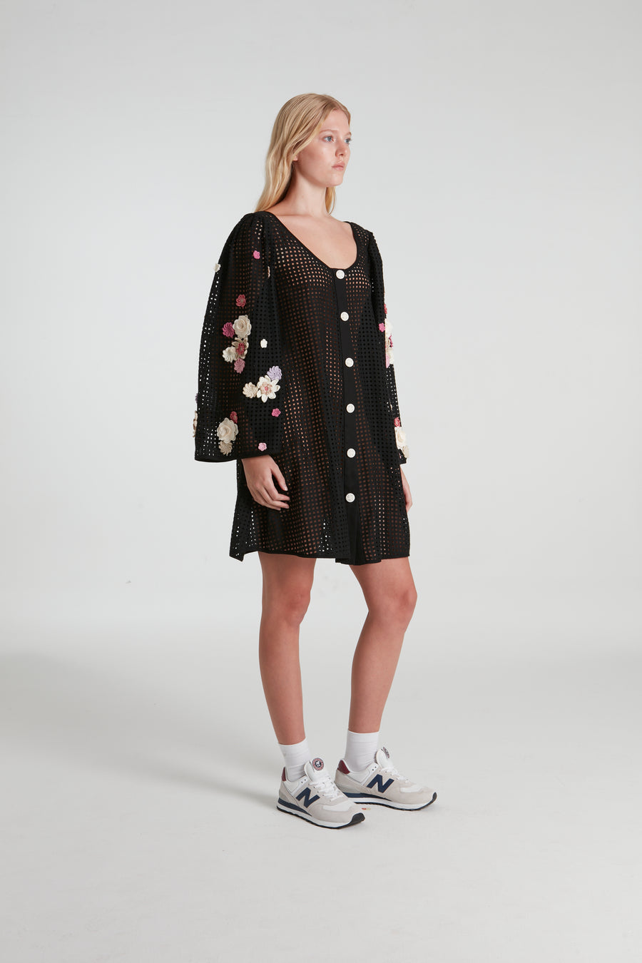 Black stenciled short dress decorated with knitted flowers